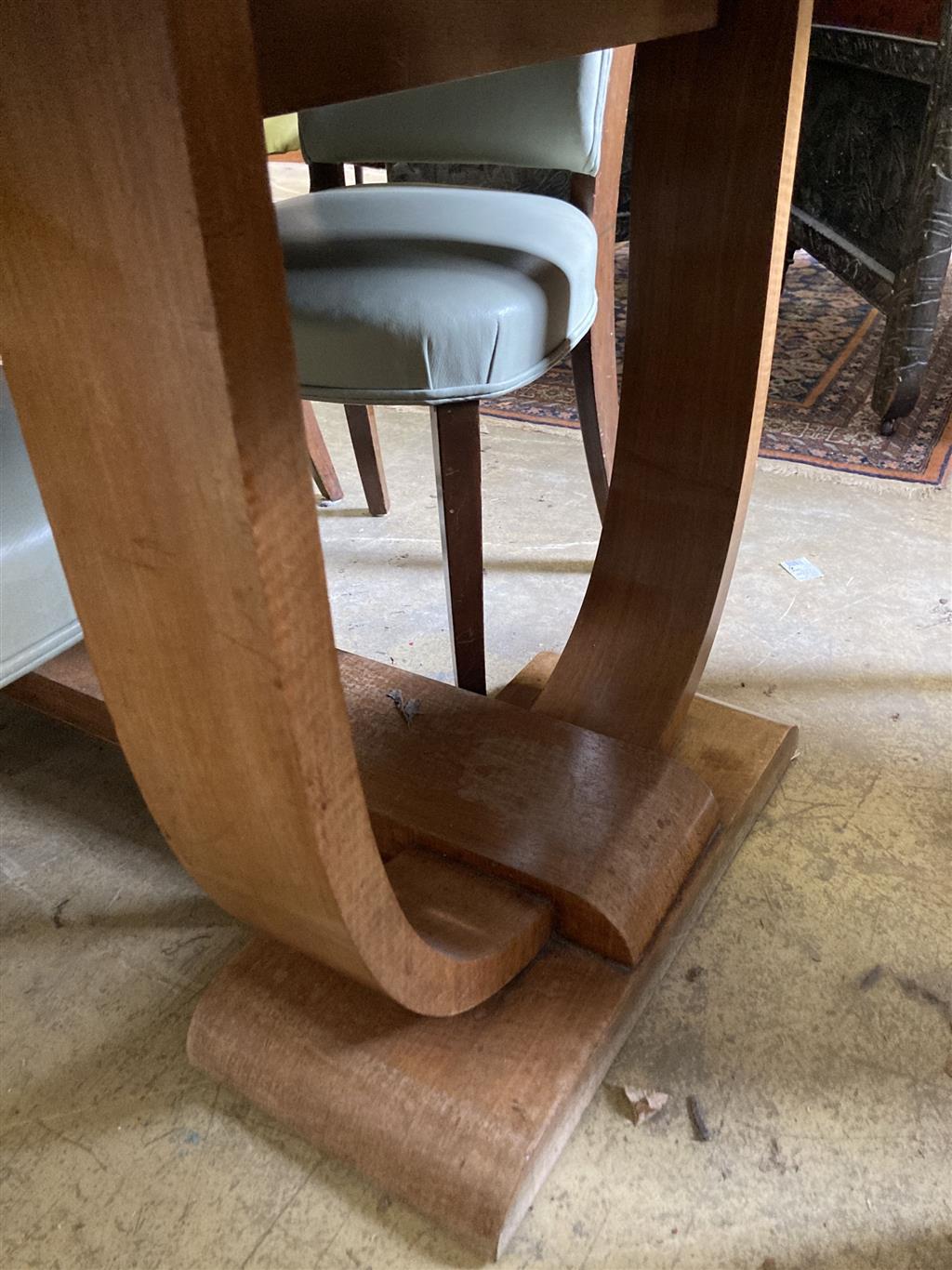 An Art Deco burr walnut dining table, width 214cm, depth 99cm, height 76cm together with four chairs